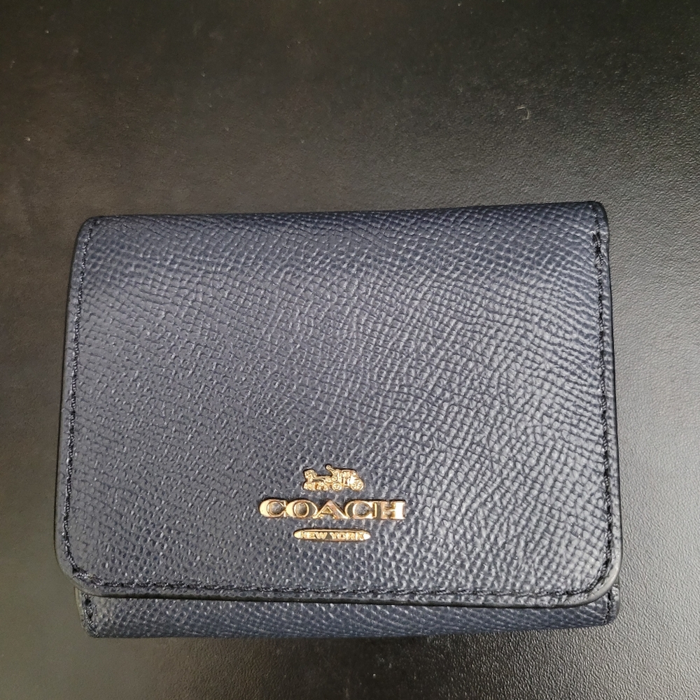 Coach trifold wallet in navy crossgrain leather.